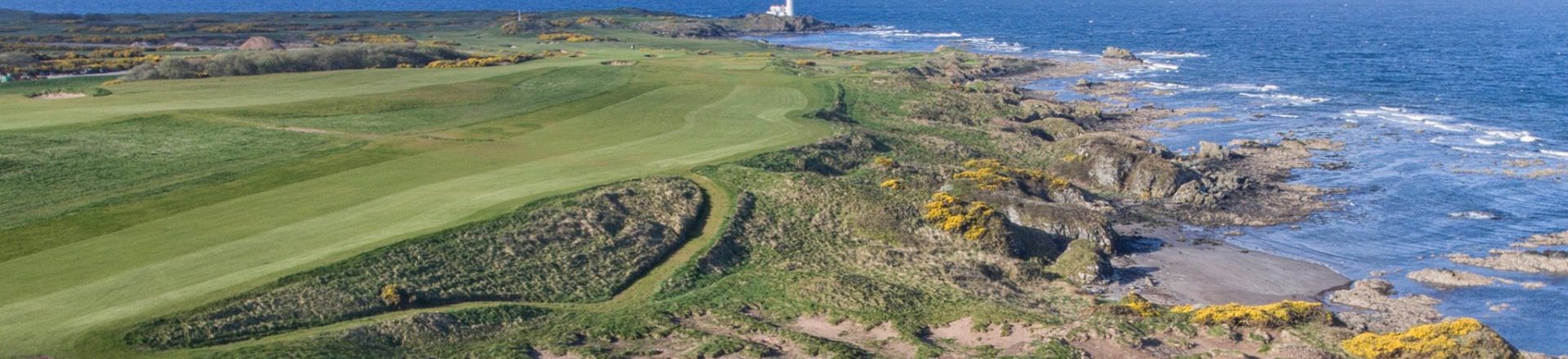 Experience the timeless beauty of King Robert The Bruce Golf Course at Trump Turnberry, Scotland. This image captures the essence of a legendary golfing destination, featuring meticulously crafted fairways against the backdrop of the Scottish landscape.