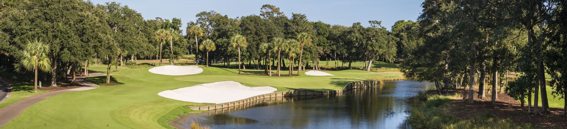 Experience the beauty of Cougar Point Golf Course at Kiawah Island Golf Resort. This captivating image captures the essence of a premier golfing destination, featuring meticulously designed fairways set against the backdrop of Kiawah's natural splendour.
